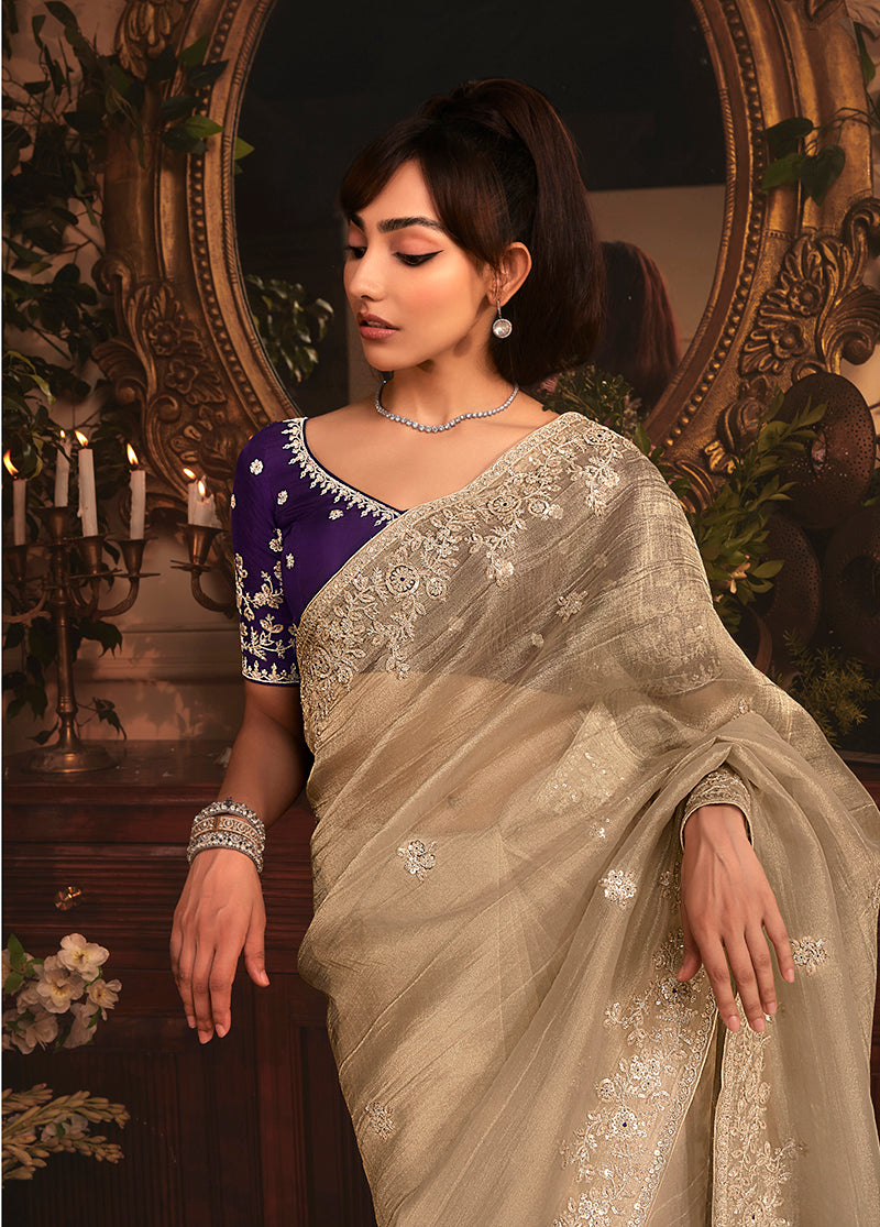 Monjolika Fashion Designer Beige Tissue Organza Saree With All Over Butta Work & Heavy Stone Embellished Border