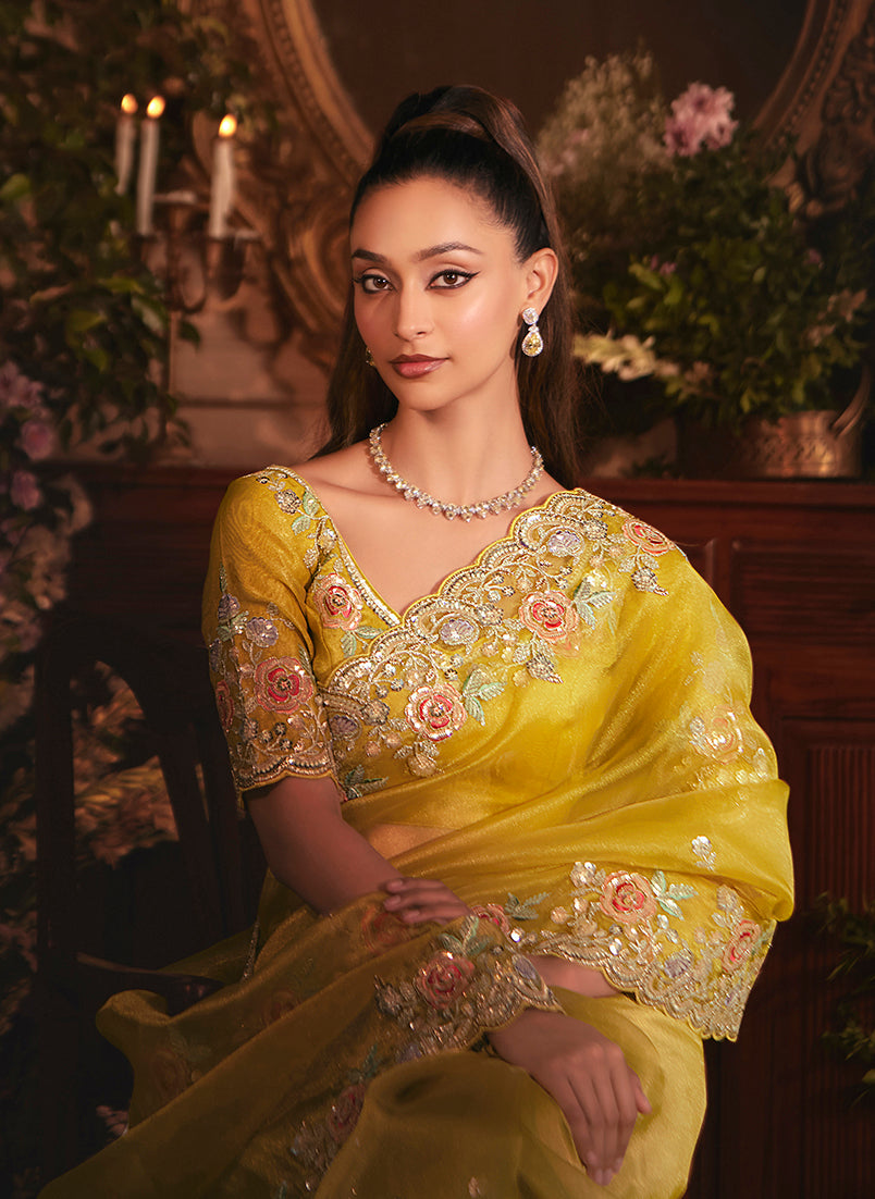 Monjolika Fashion Designer Mustard Tissue Organza Saree With All Over Butta Work & Heavy Stone Embellished Border