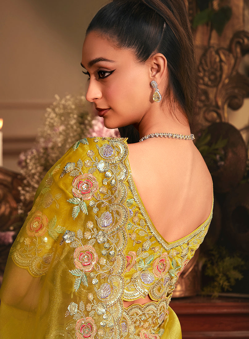 Monjolika Fashion Designer Mustard Tissue Organza Saree With All Over Butta Work & Heavy Stone Embellished Border