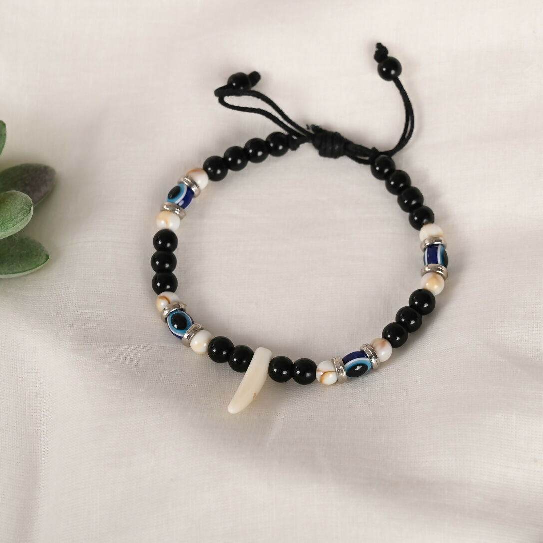 NVR Women & Men Black Evil Eye Rakhi With Roli Chawal - Distacart