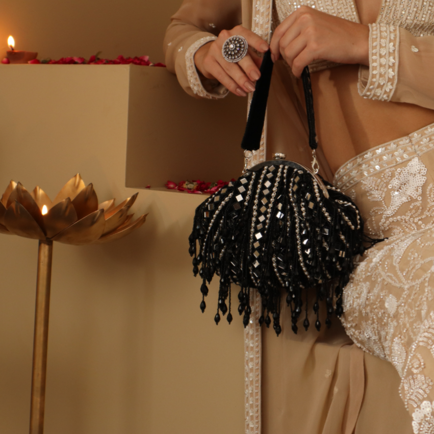 New Stylish Partywear Black Mirror Work Potli Bag for Womens by House of Ree