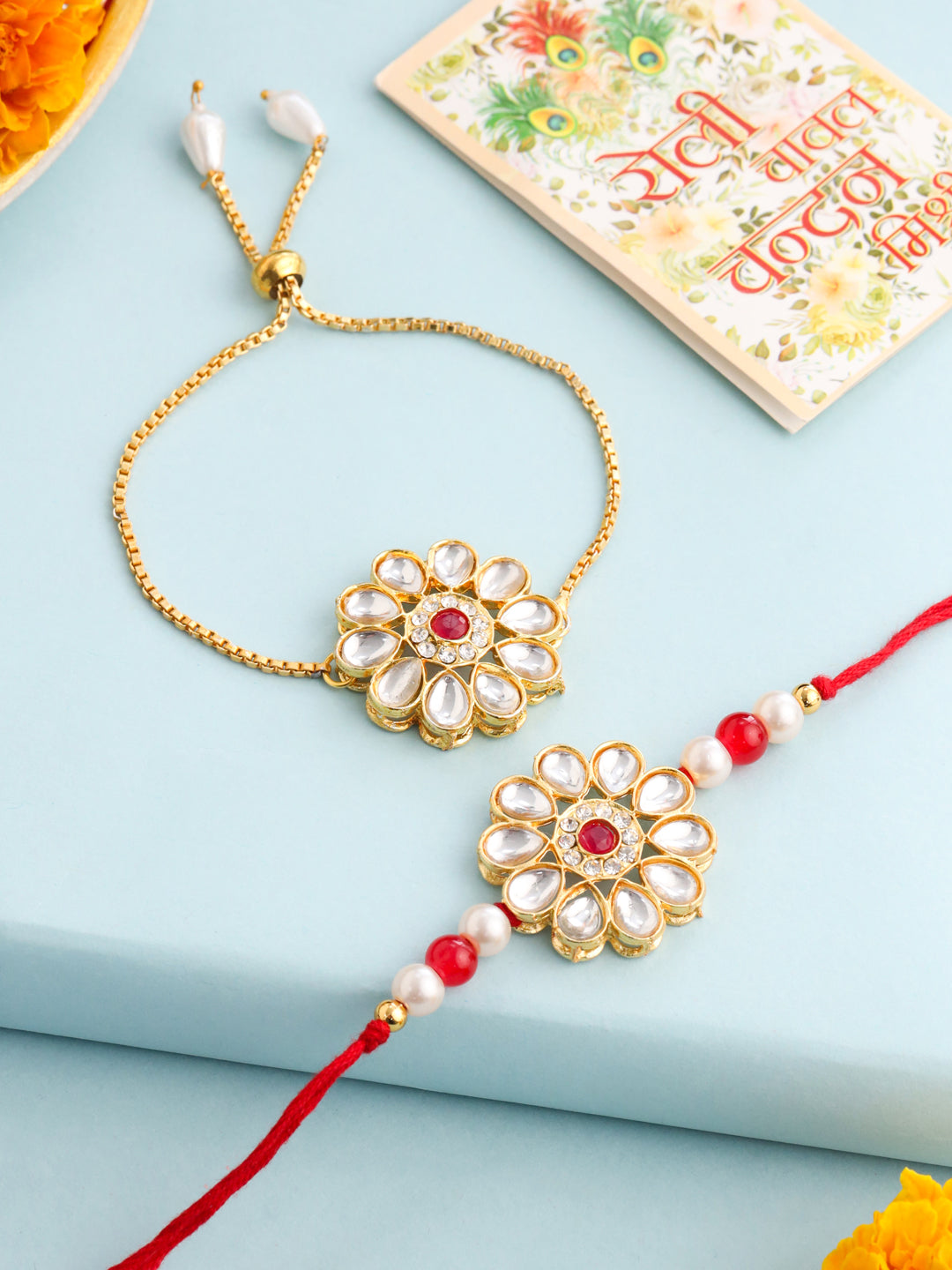 NVR Set of 2 Gold Toned Kundan Studded Floral Design Bhaiya Bhabhi Rakhi Set with Roli Chawal Chandan & Mishri