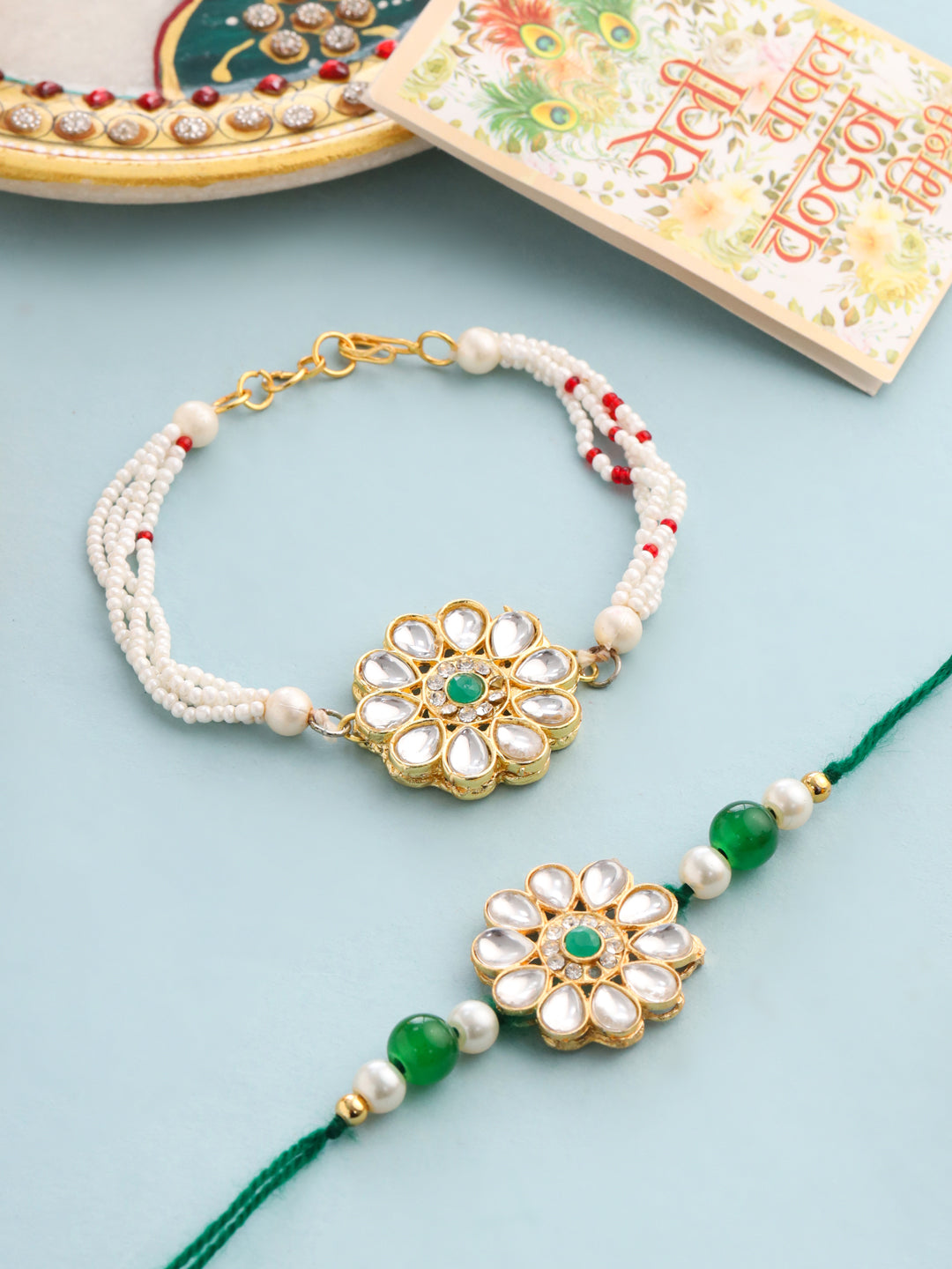 NVR Set of 2 Kundan Studded Floral Design Gold Toned Bhaiya Bhabhi Rakhi Set with Roli Chawal Chandan & Mishri