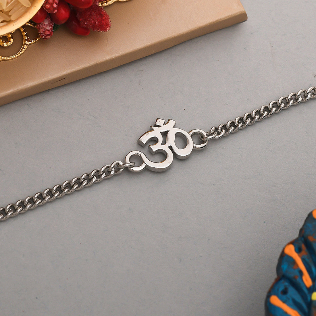 trueBrowns Auspicious Om Silver Tone Bracelet Style Rakhi