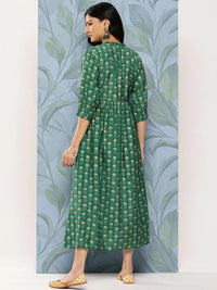 Thumbnail for https://cdn.shopify.com/s/files/1/0341/4805/7228/files/green-printed-silk-fit-and-flare-dress-libas-4.jpg?v=1739182223