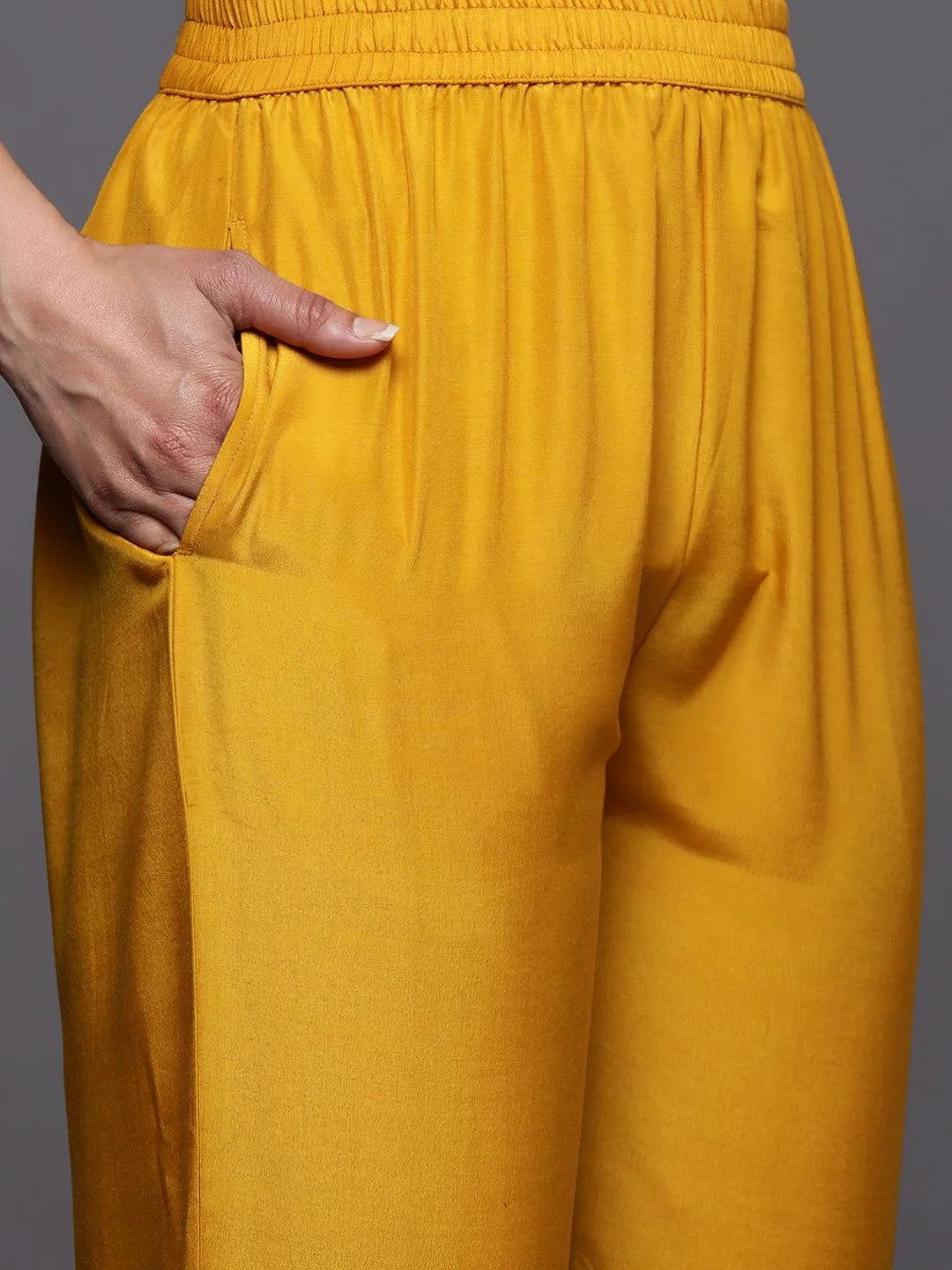 https://cdn.shopify.com/s/files/1/0341/4805/7228/files/mustard-self-design-silk-blend-straight-kurta-with-trousers-and-dupatta-libas-6.jpg?v=1739541746