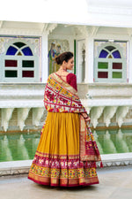 Thumbnail for Evanik Mustard Traditional Style Tussar Silk Patola Print With Foil Work Unstitched Lehenga Choli