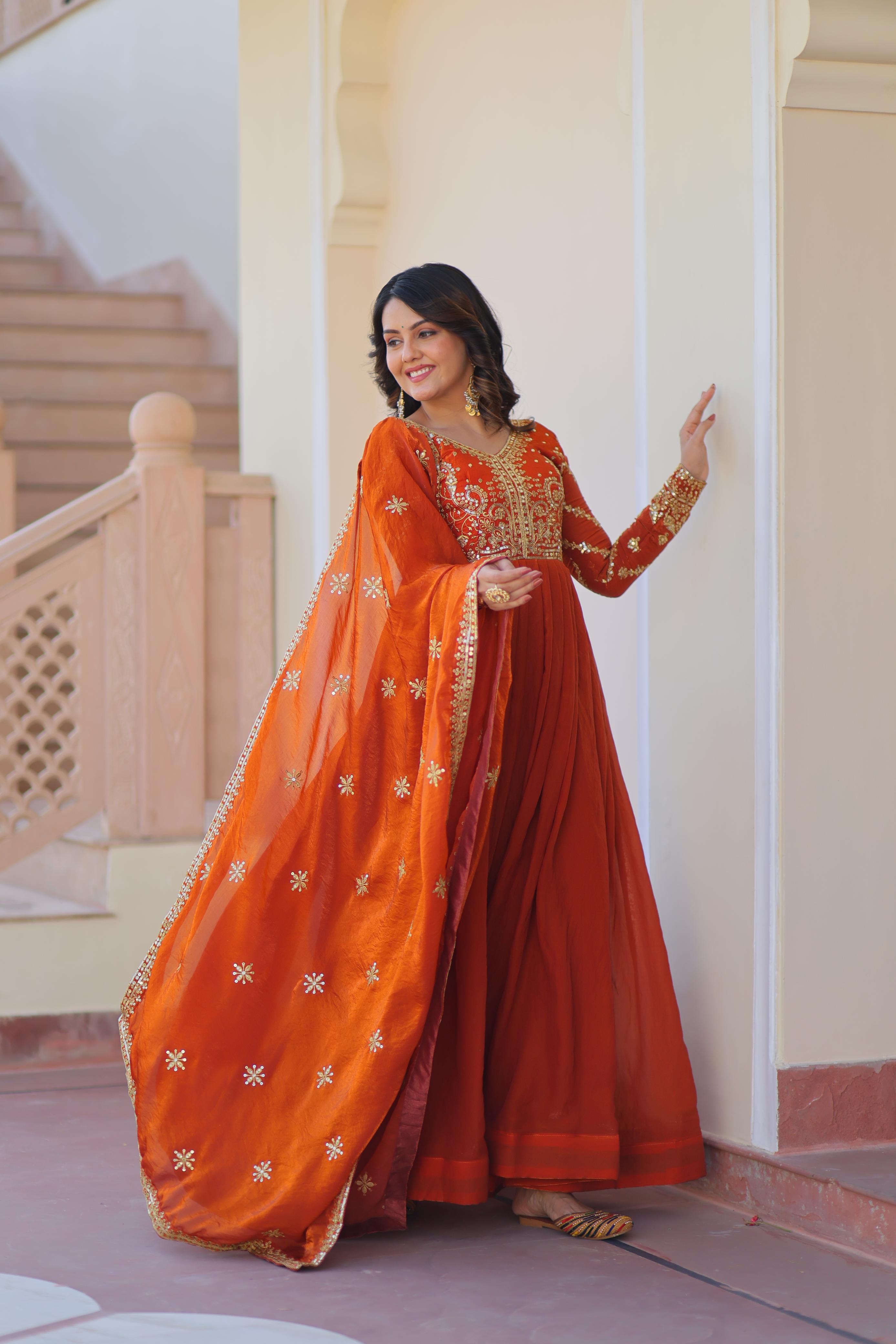 Evanik Orange Fendy Fabric With Zari & Sequins Embroidered work Gown Dupatta