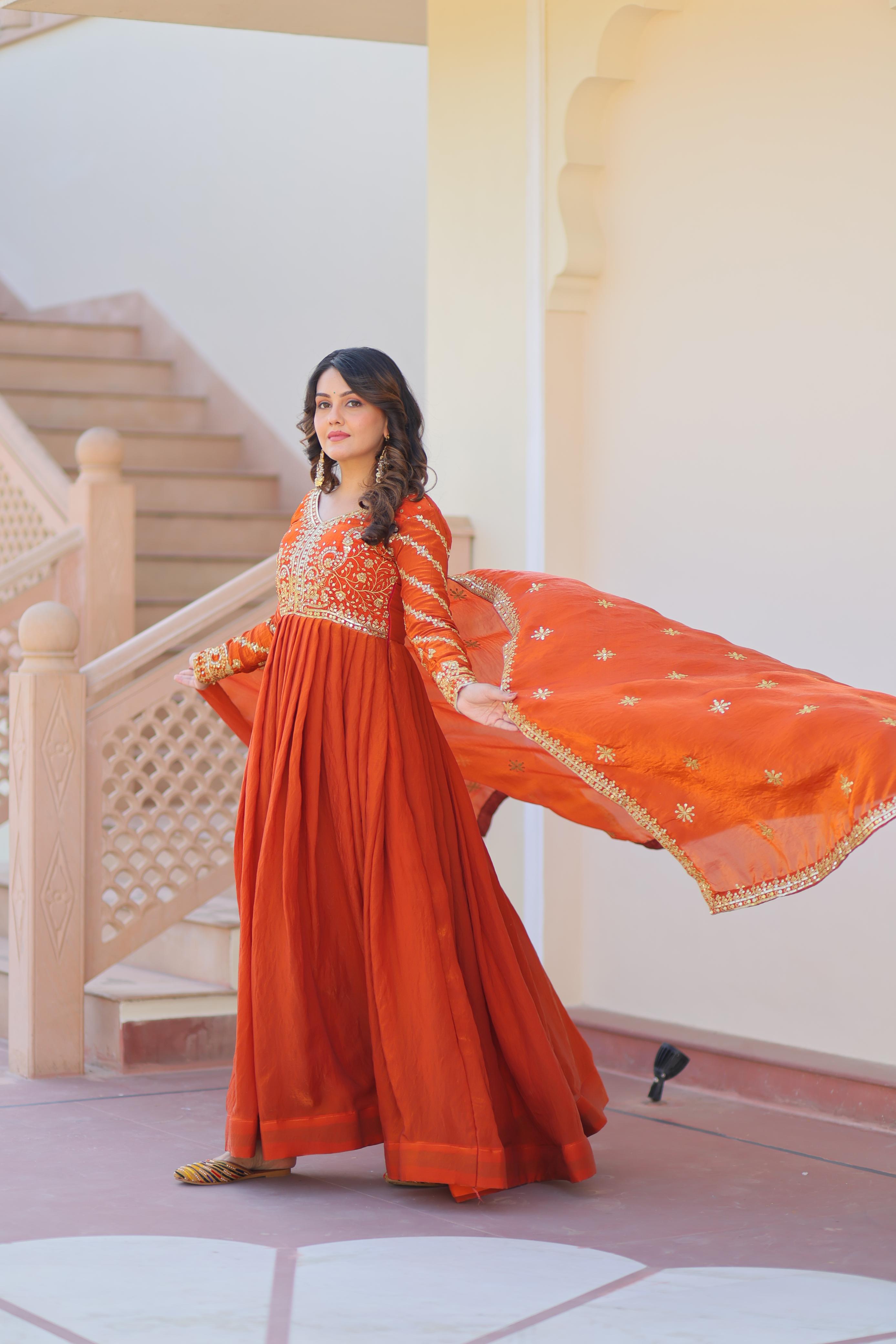Evanik Orange Fendy Fabric With Zari & Sequins Embroidered work Gown Dupatta