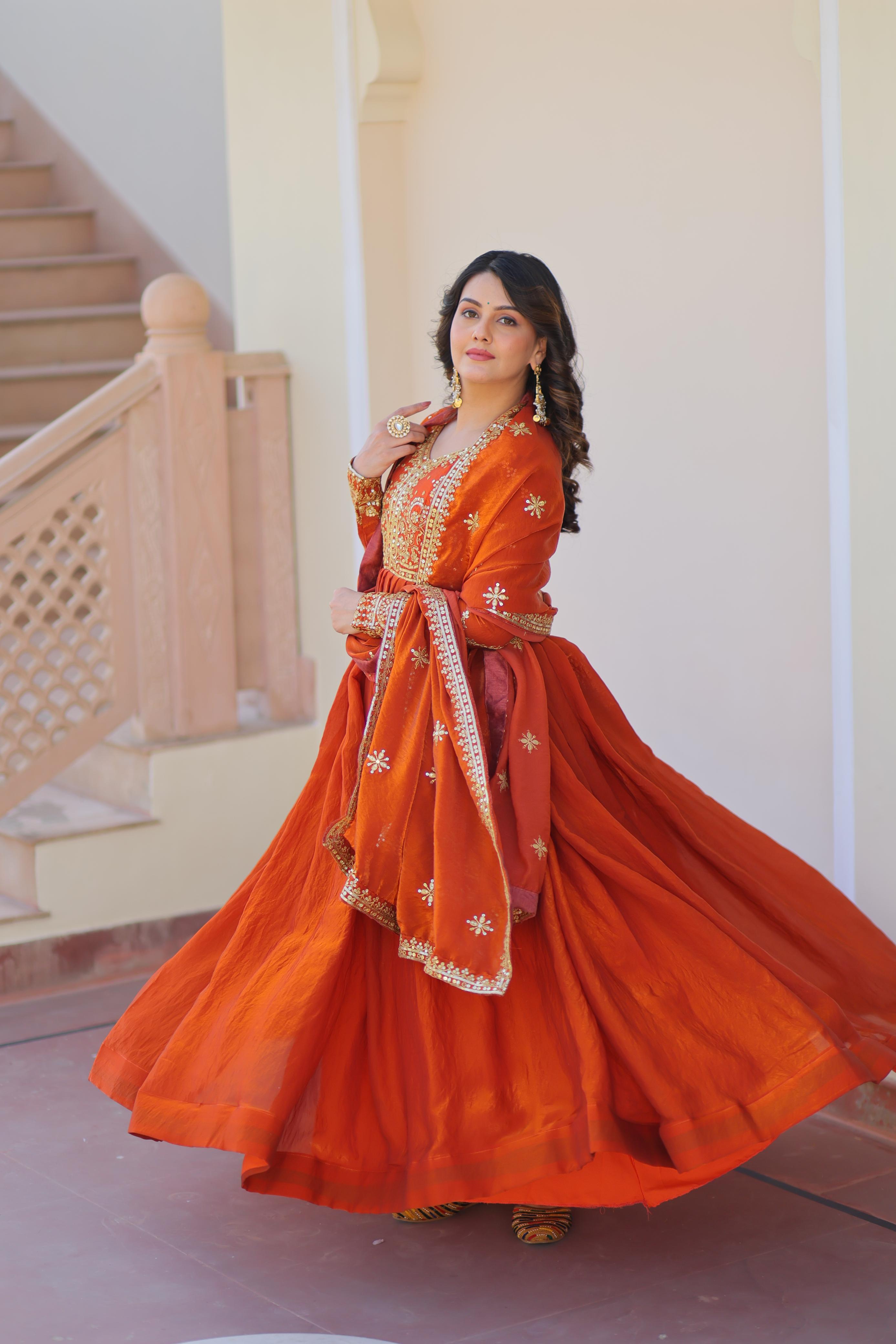 Evanik Orange Fendy Fabric With Zari & Sequins Embroidered work Gown Dupatta