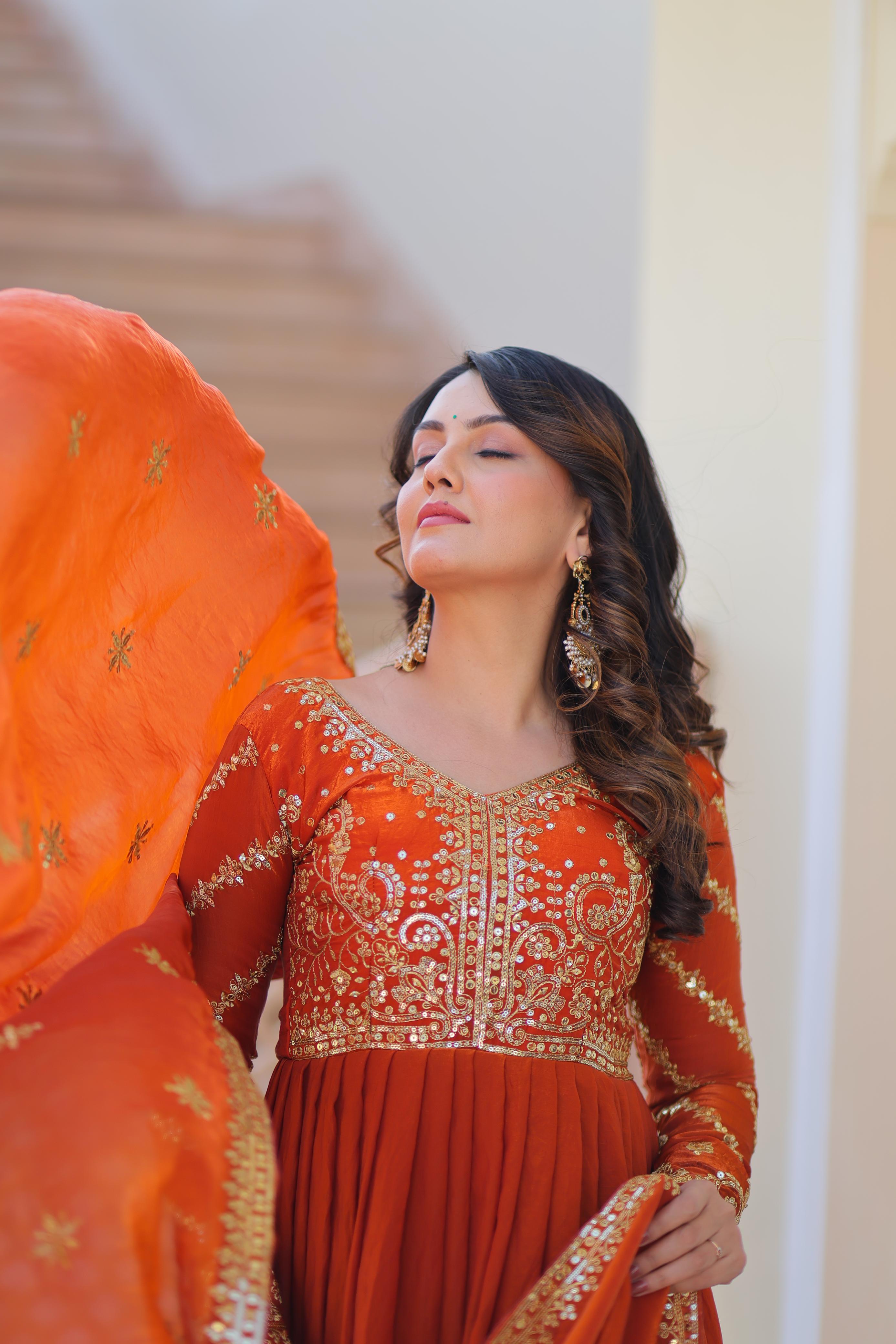 Evanik Orange Fendy Fabric With Zari & Sequins Embroidered work Gown Dupatta