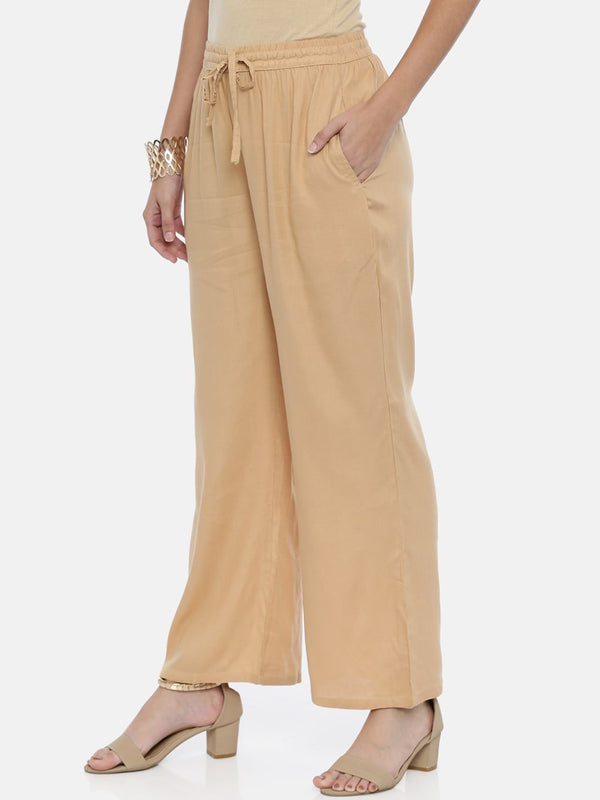 Souchii Beige Solid Flared Palazzos - Distacart