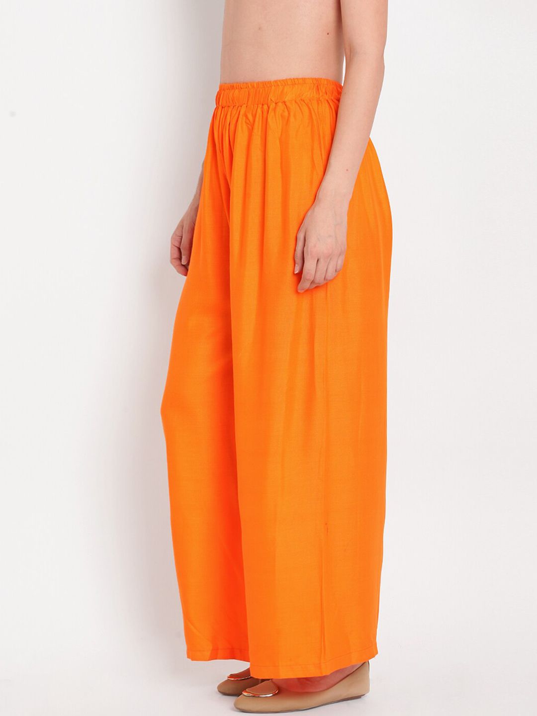 TAG 7 Women Orange Solid Flared Palazzos - Distacart