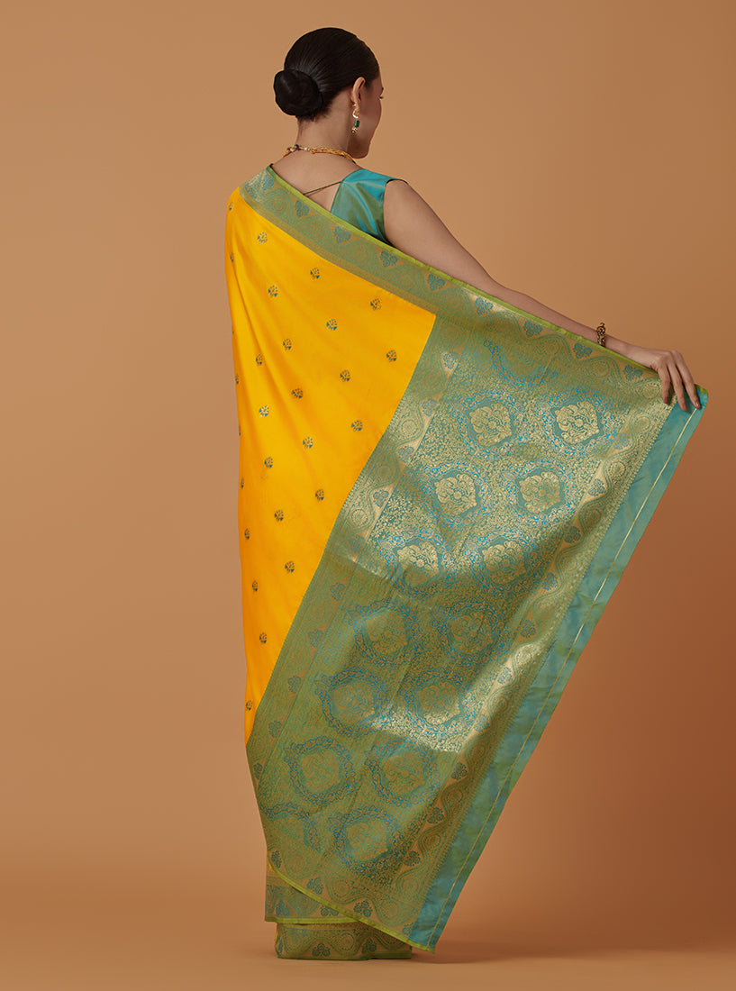 Monjolika Fashion Yellow Banarasi Silk Blend SareeWith Traditional & Modern Dulha Dulhan Figure Zari Woven Detailing - Distacart