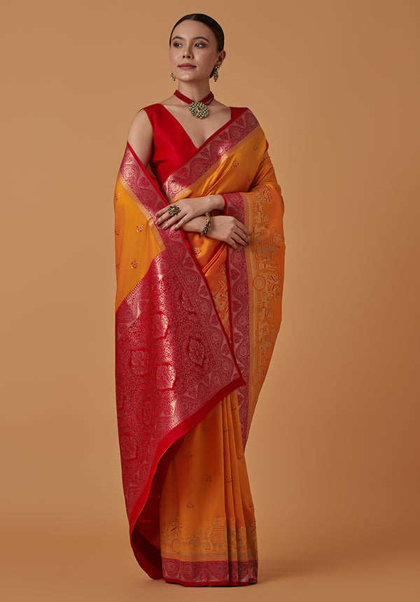 Monjolika Fashion Amber Banarasi Silk Blend SareeWith Traditional & Modern Dulha Dulhan Figure Zari Woven Detailing