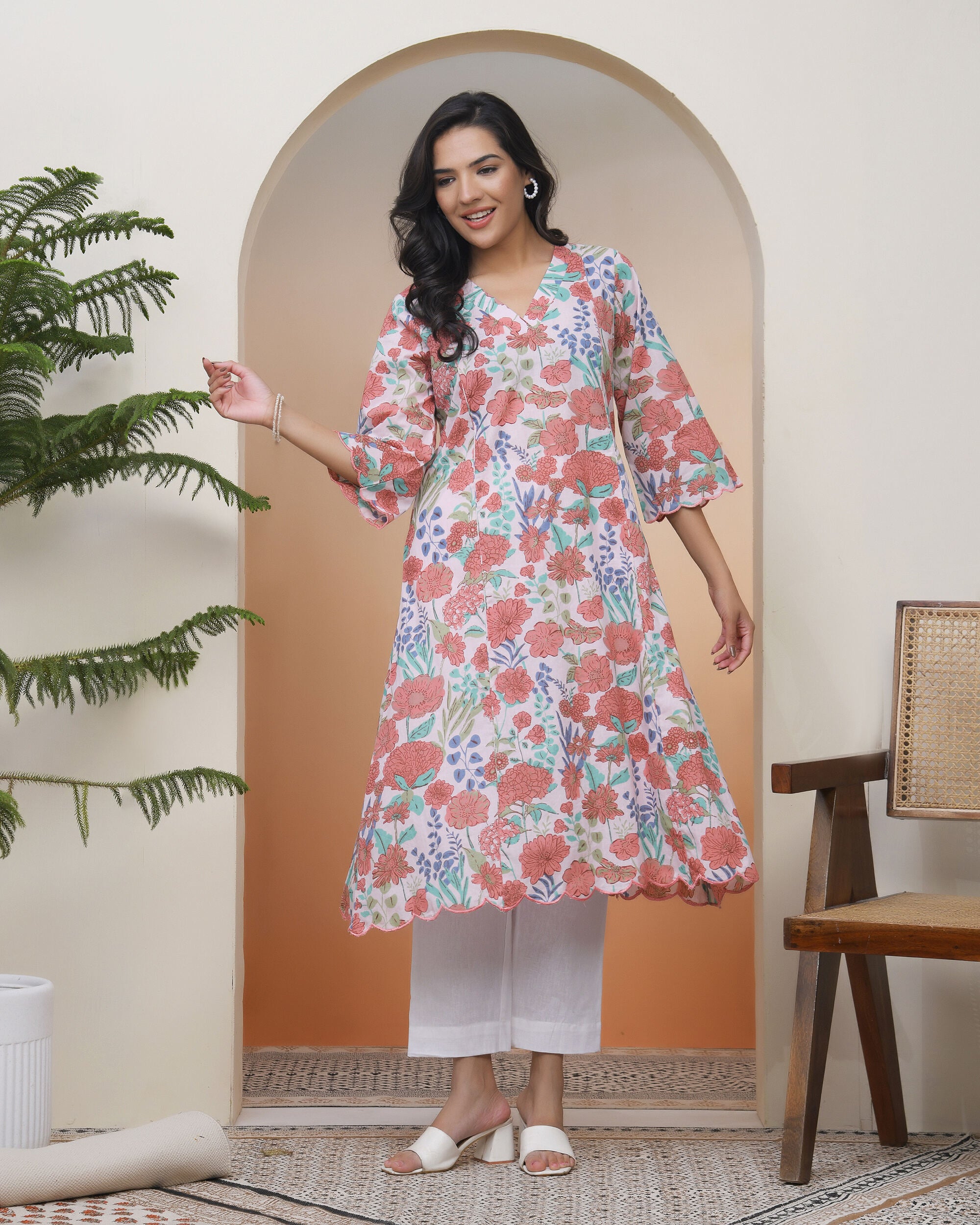 Vaasva Women Peach Floral Cotton Printed Flare Kurti