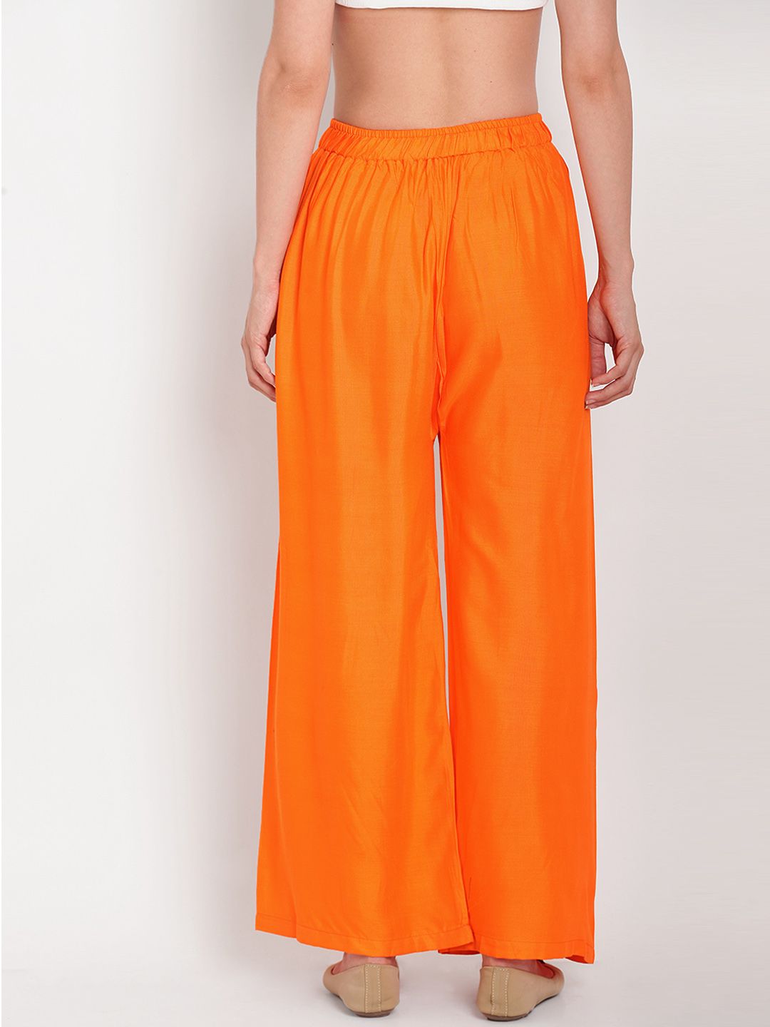 TAG 7 Women Orange Solid Flared Palazzos - Distacart