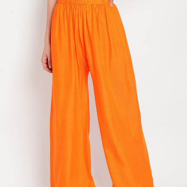 TAG 7 Women Orange Solid Flared Palazzos - Distacart