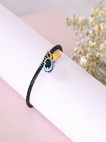 Thumbnail for NVR Women & Men Black Evil Eye Spring Ring Rakhi With Roli Chawal - Distacart