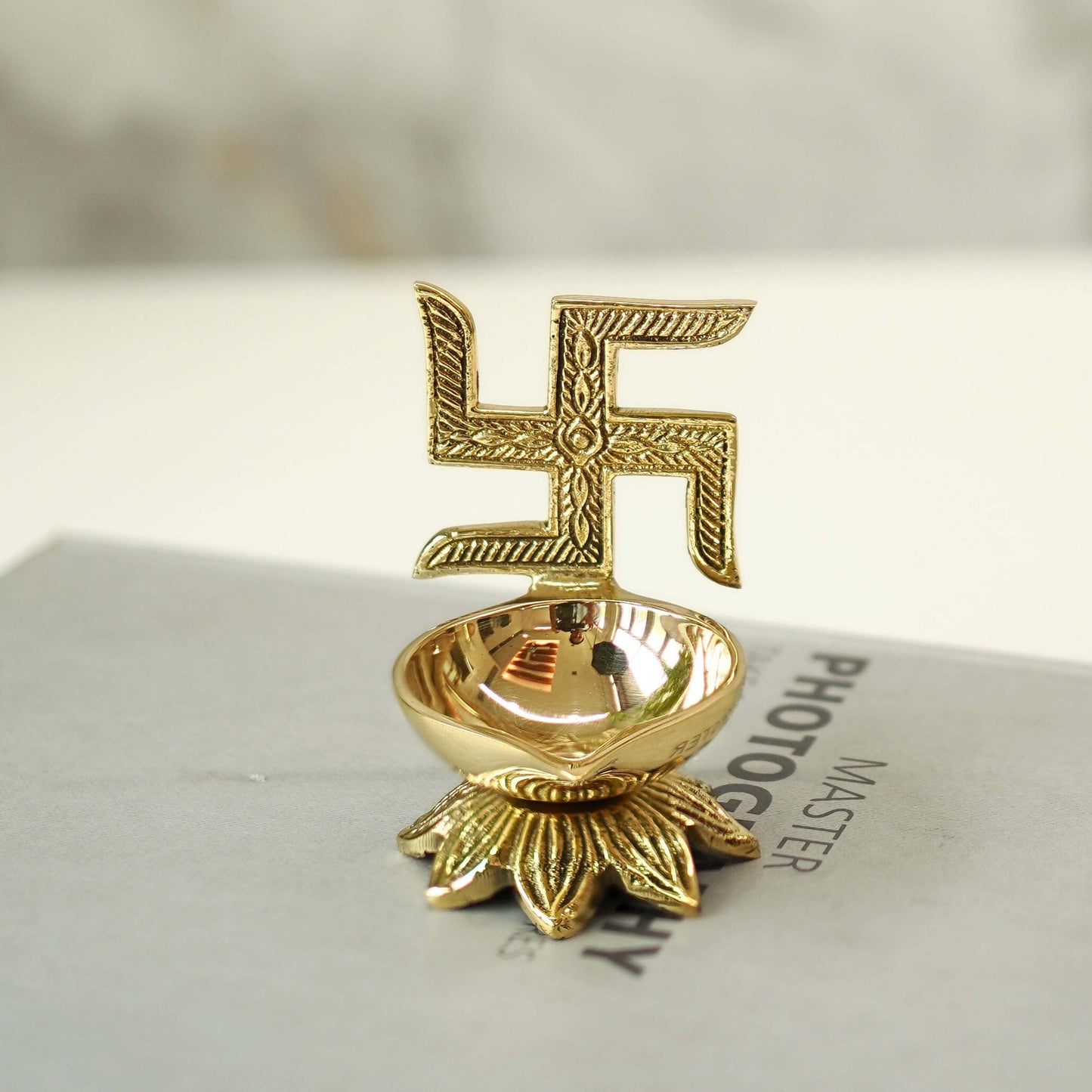swastik brass diya