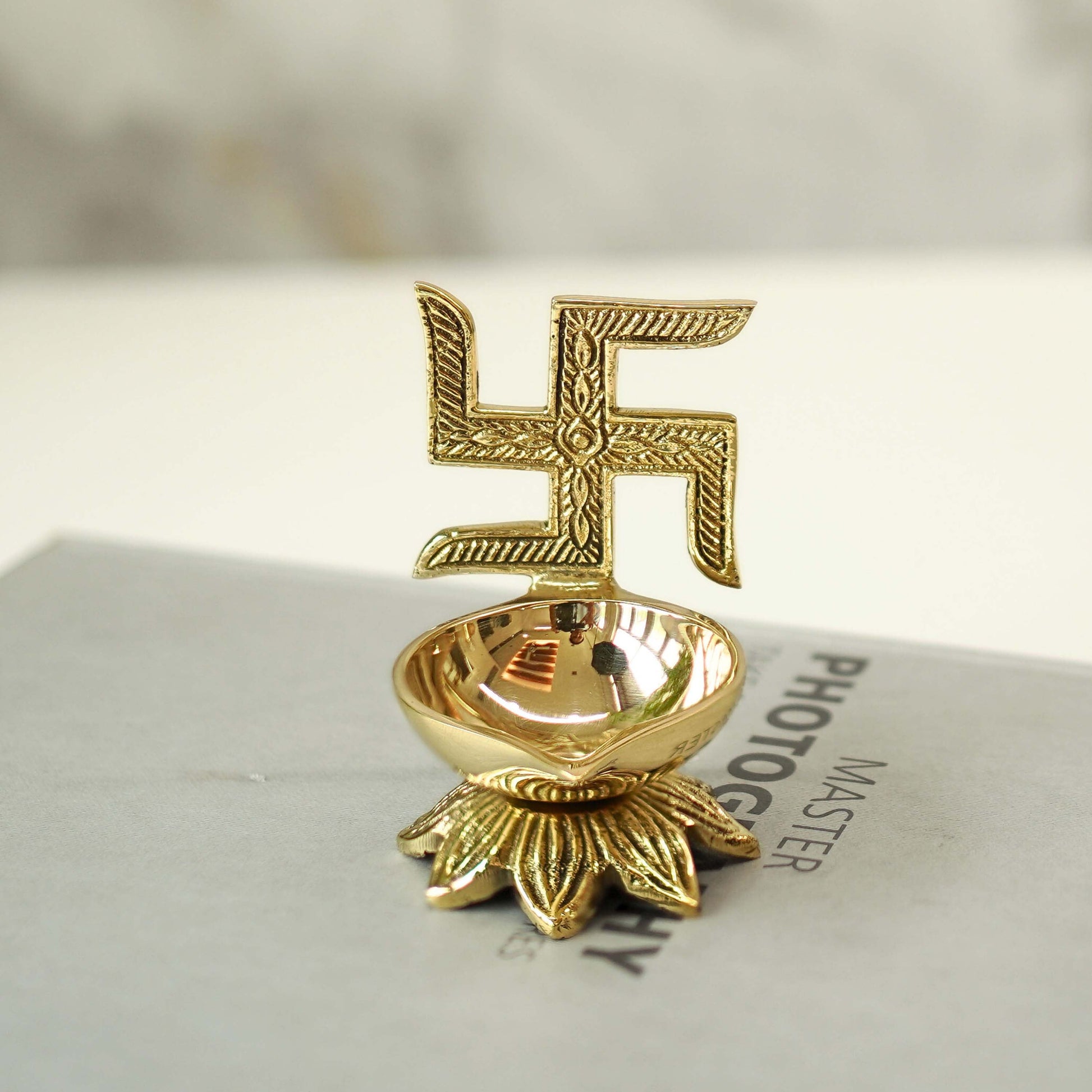 swastik brass diya
