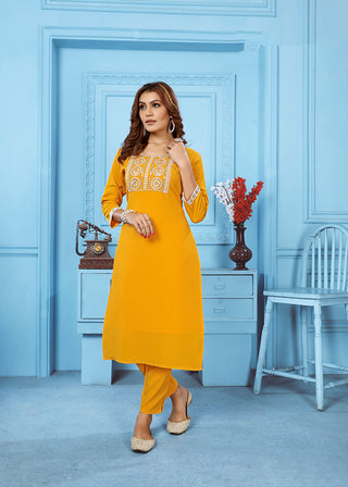 Monjolika Fashion Yellow Rinkal Cotton With Embroidered Work Kurti With Pant