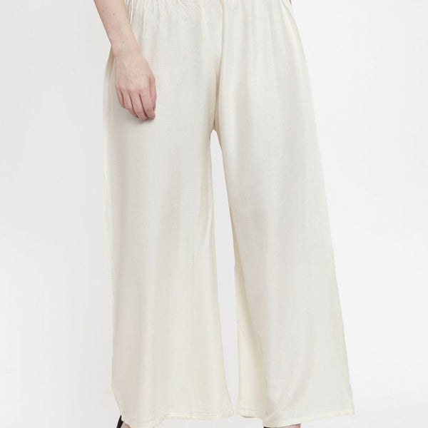 TAG 7 Women Off-White Solid Flared Palazzos - Distacart