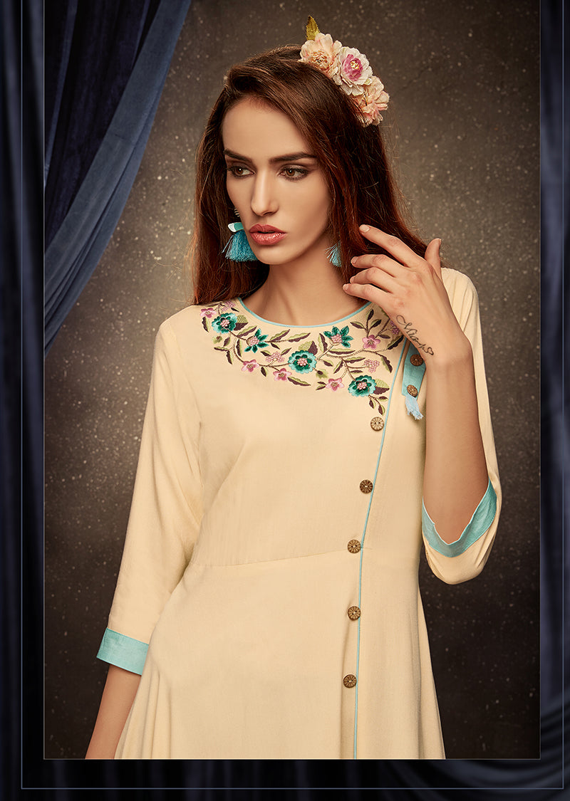Monjolika Fashion Cream Embroidered Rayon Party Wear Kurti
