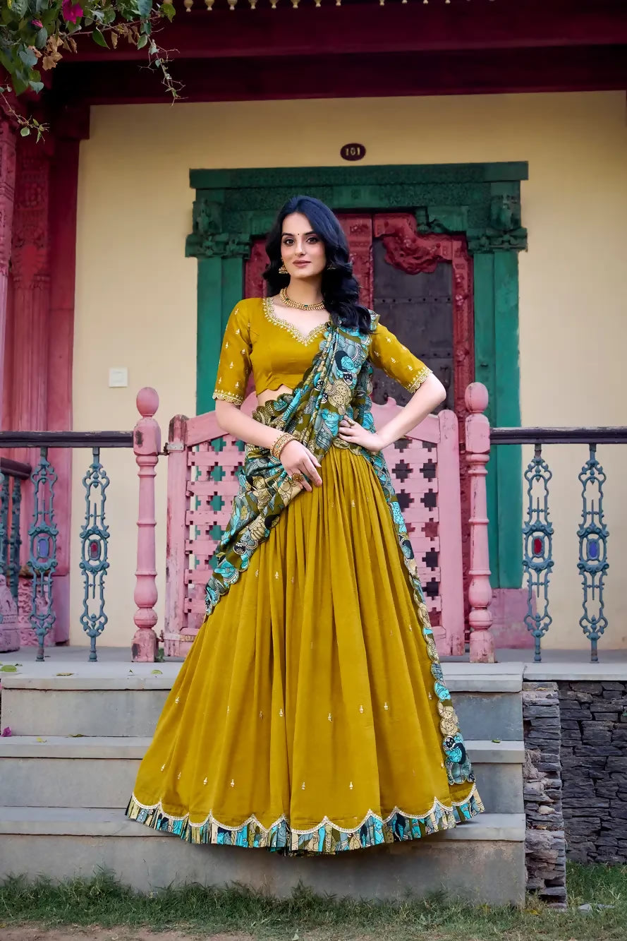 Looknbook Art Vichitra Silk Sequins and Thread Embroidery Work With Kalamkari Print Border Lehenga Choli-Mustard