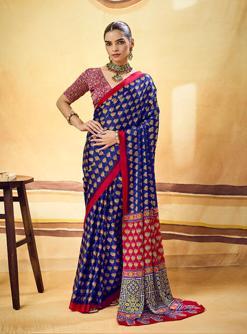 Monjolika Fashion Navy Blue Satin Printed Saree With Orange Border And Unstiched Blouse - Dista