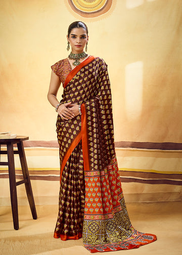 Monjolika Fashion Brown Satin Printed Saree With Orange Border And Unstiched Blouse - Dista