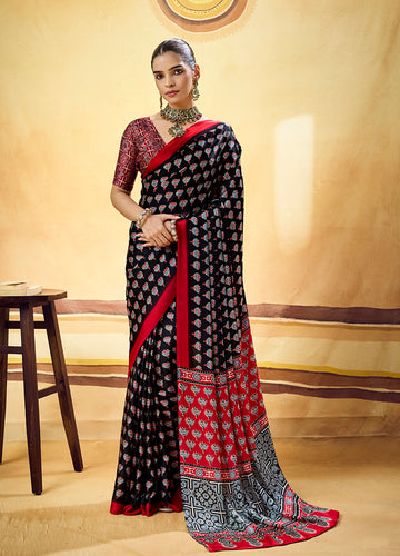 Monjolika Fashion Black Satin Printed Saree With Orange Border And Unstiched Blouse - Dista