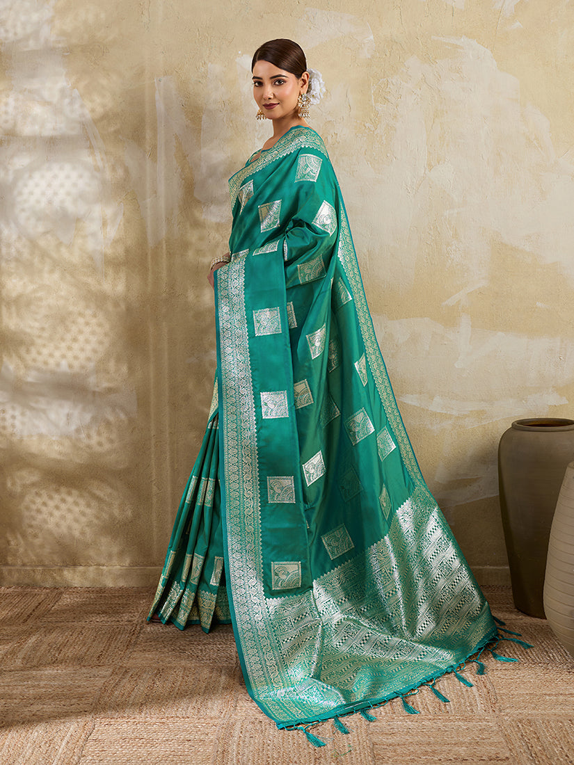 Monjolika Fashion Teal Zari Woven Banarasi Silk Blend Saree With Blouse Piece