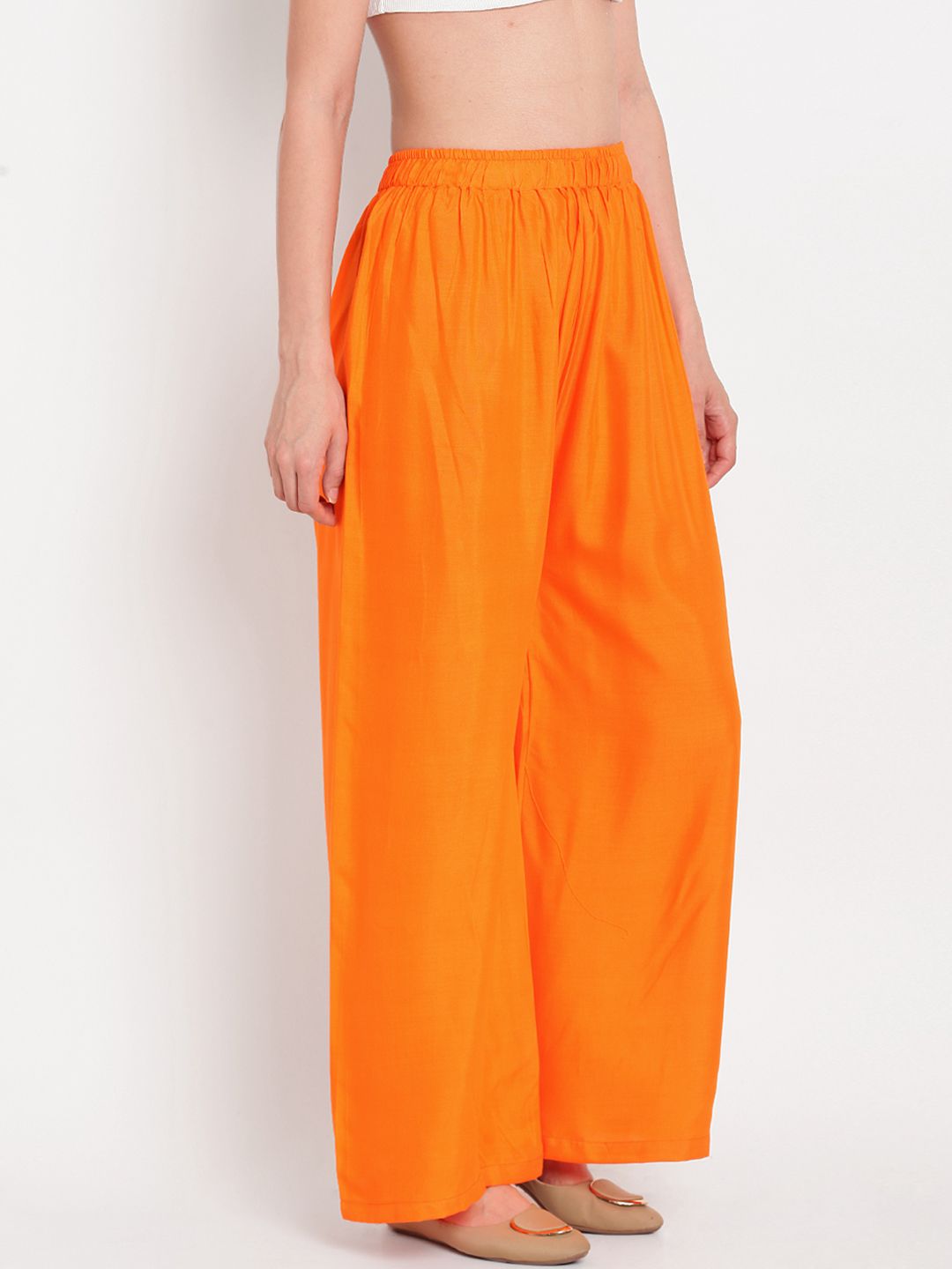 TAG 7 Women Orange Solid Flared Palazzos - Distacart