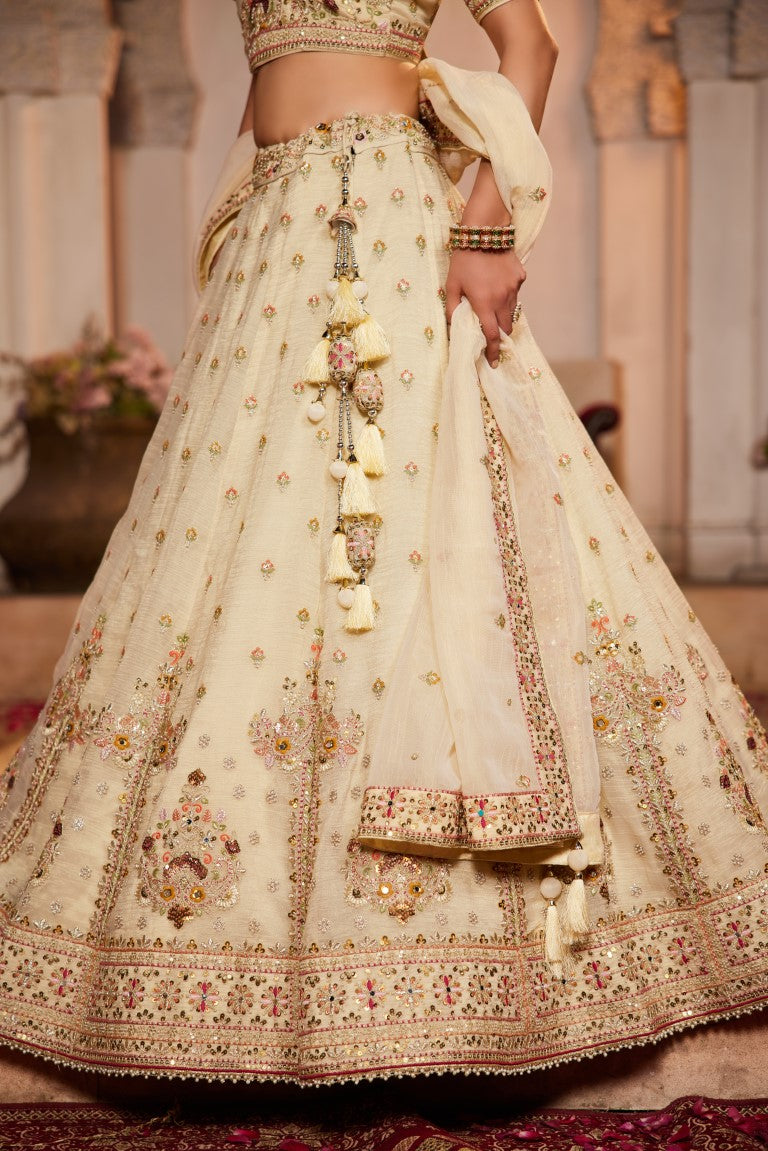 Aastha Fashion Cream Tissue Embroidery Lehenga Choli
