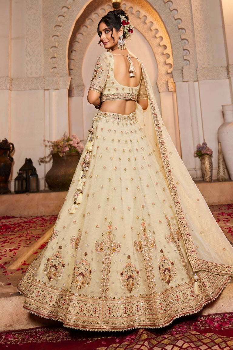 Aastha Fashion Cream Tissue Embroidery Lehenga Choli