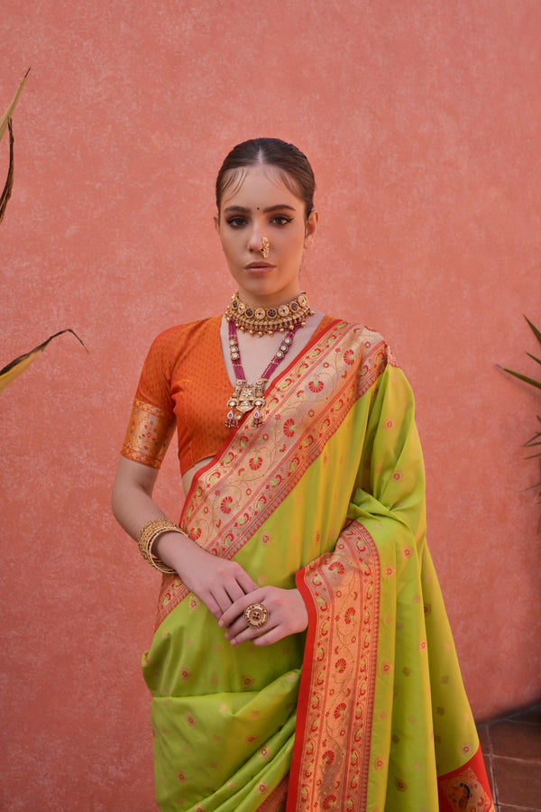 Aastha Fashion Parrot Green Soft Banarasi Silk Weaving Border And Rich Zari Woven Saree