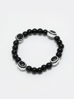 Thumbnail for NVR Women & Men Black Evil Eye Elasticated Rakhi With Roli Chawal - Distacart