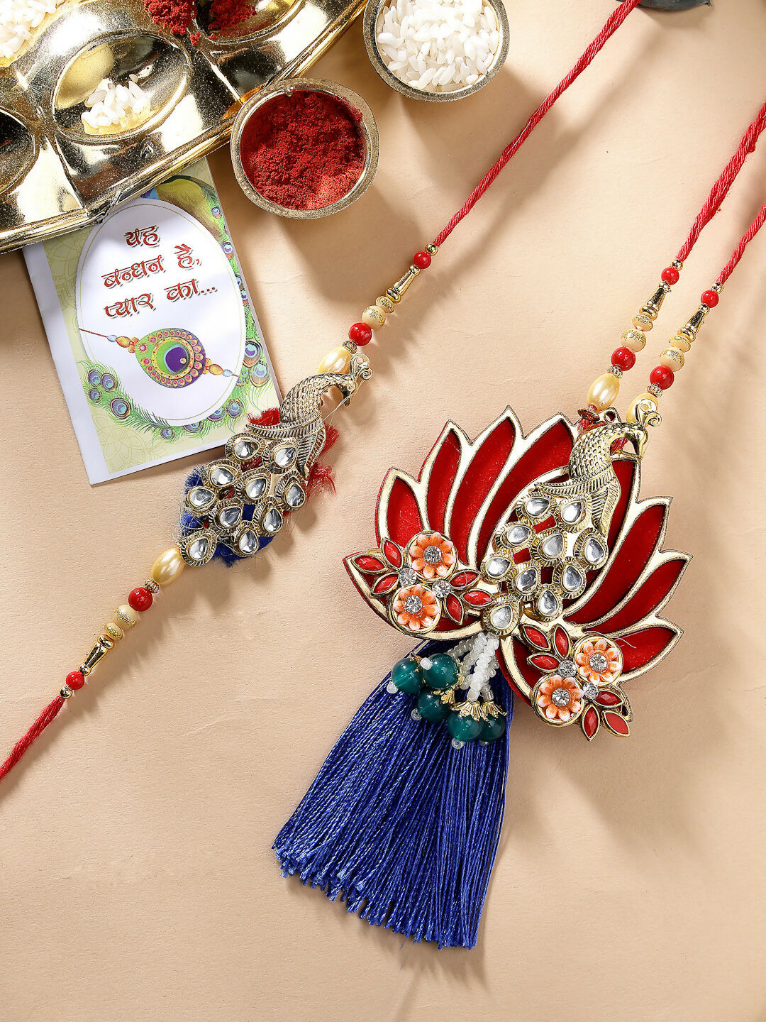 NVR Women & Men Set of 2 Gold-Toned Peacock Design Stone-Studded Bhaiya Bhabhi Rakhi With Roli Chawal - Distacart
