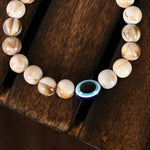 Thumbnail for NVR Women & Men Cream-colored Evil Eye Elasticated Rakhi With Roli Chawal - Distacart