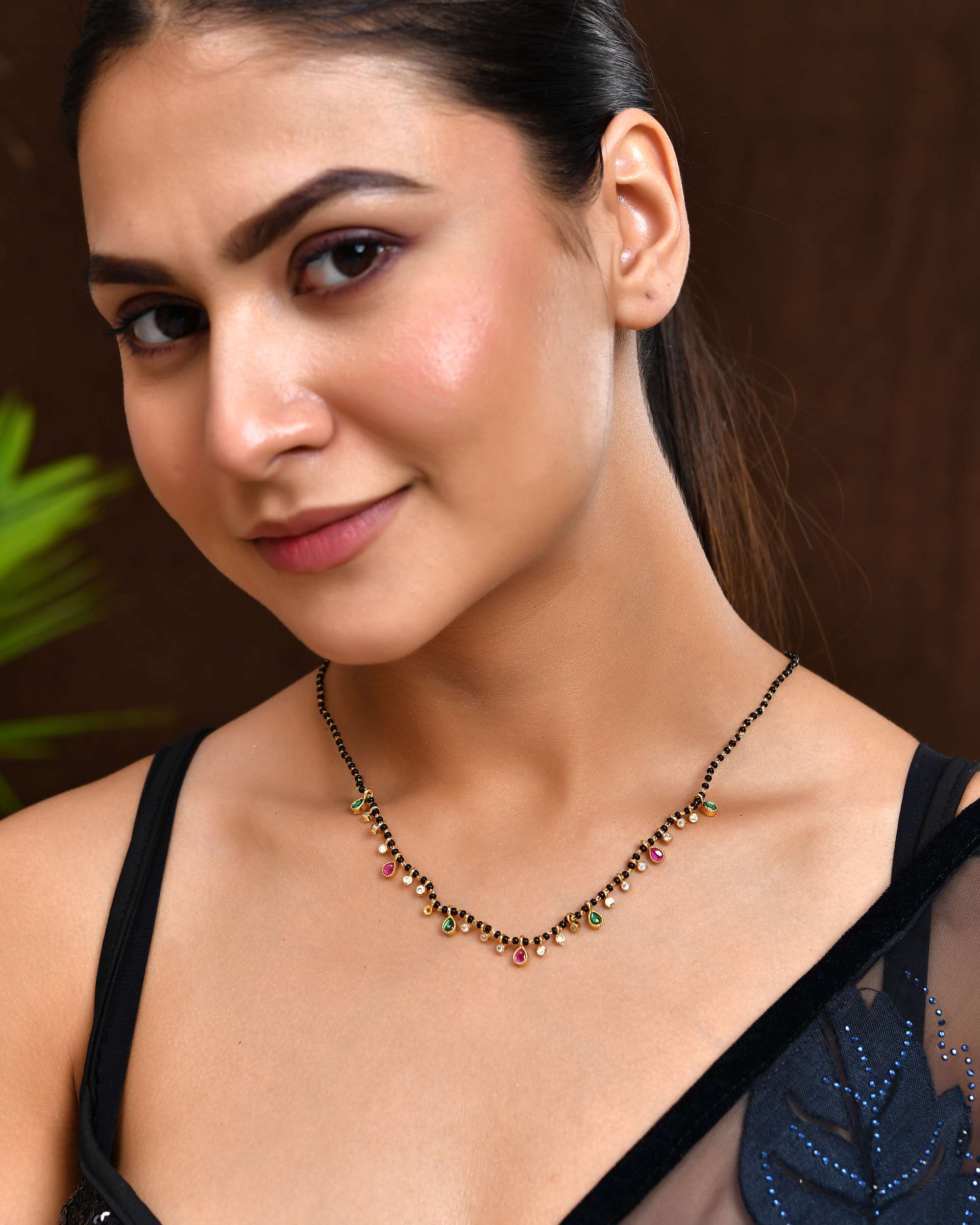 Jewels Nest Elegant Black Beads Mangalsutra with Green & Red Stone Drops – Silver Finish