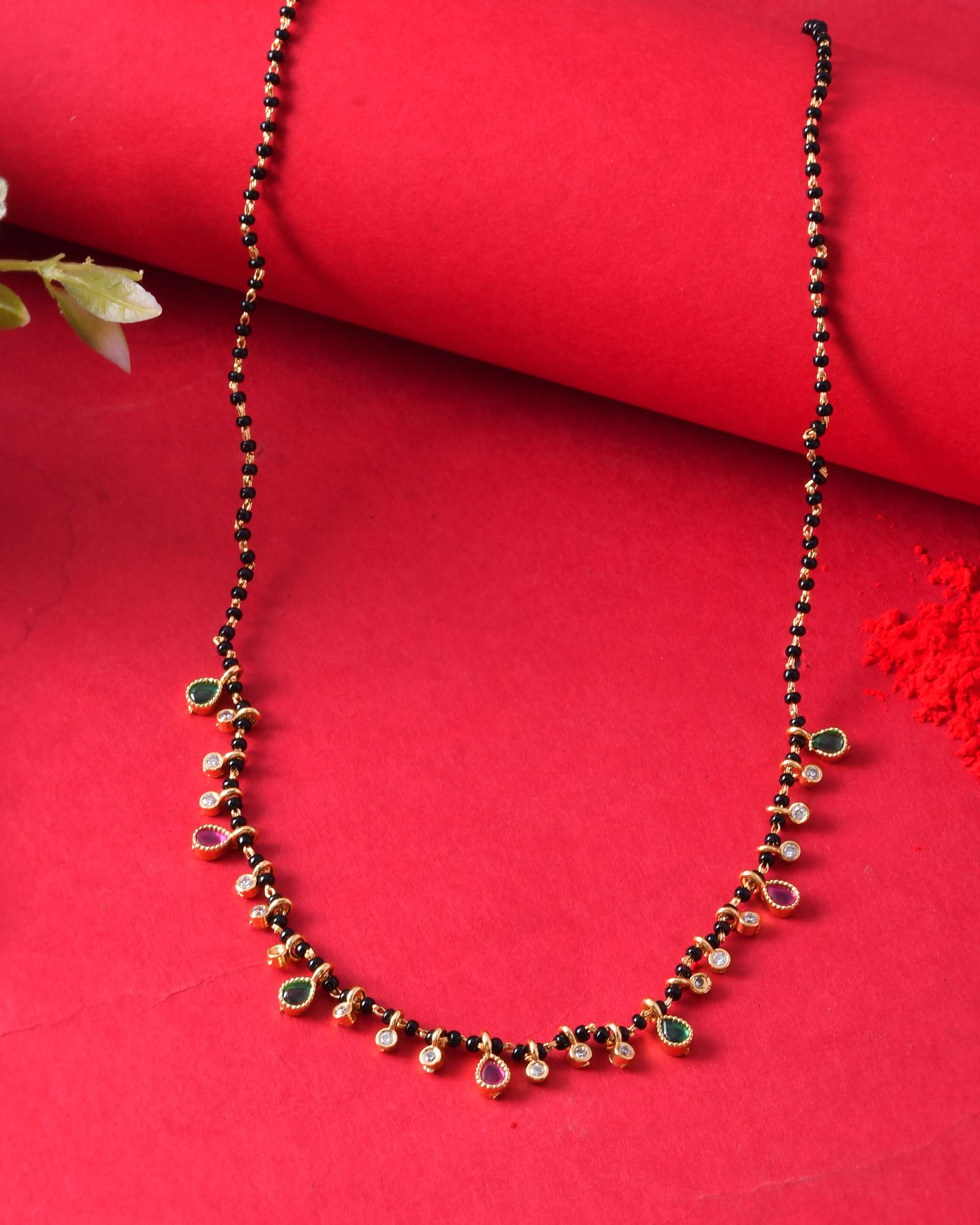 Jewels Nest Elegant Black Beads Mangalsutra with Green & Red Stone Drops – Silver Finish