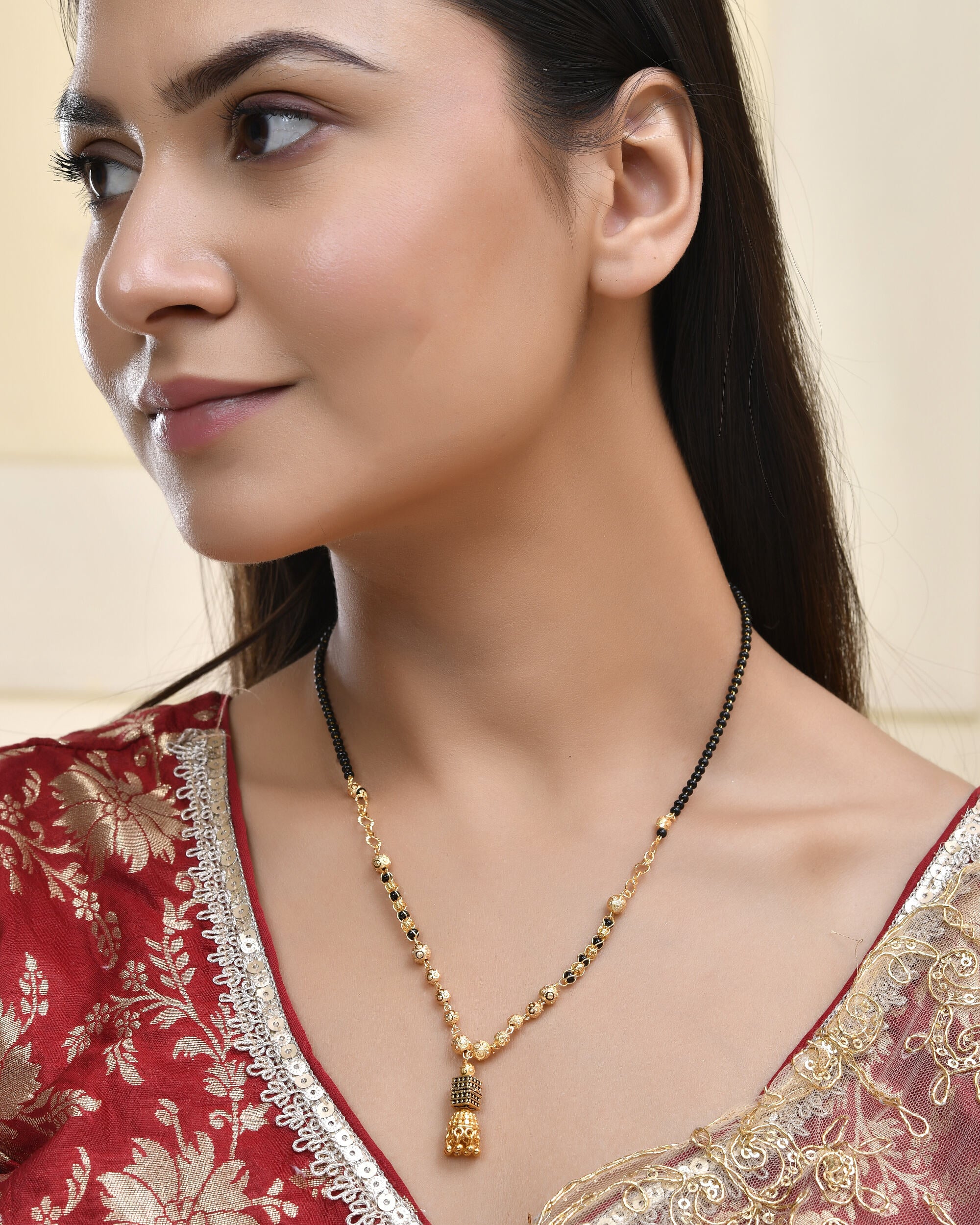 Jewels Nest Graceful Gold-Polished Black Bead Mangal Sutra with Intricate Pendant - Distacart