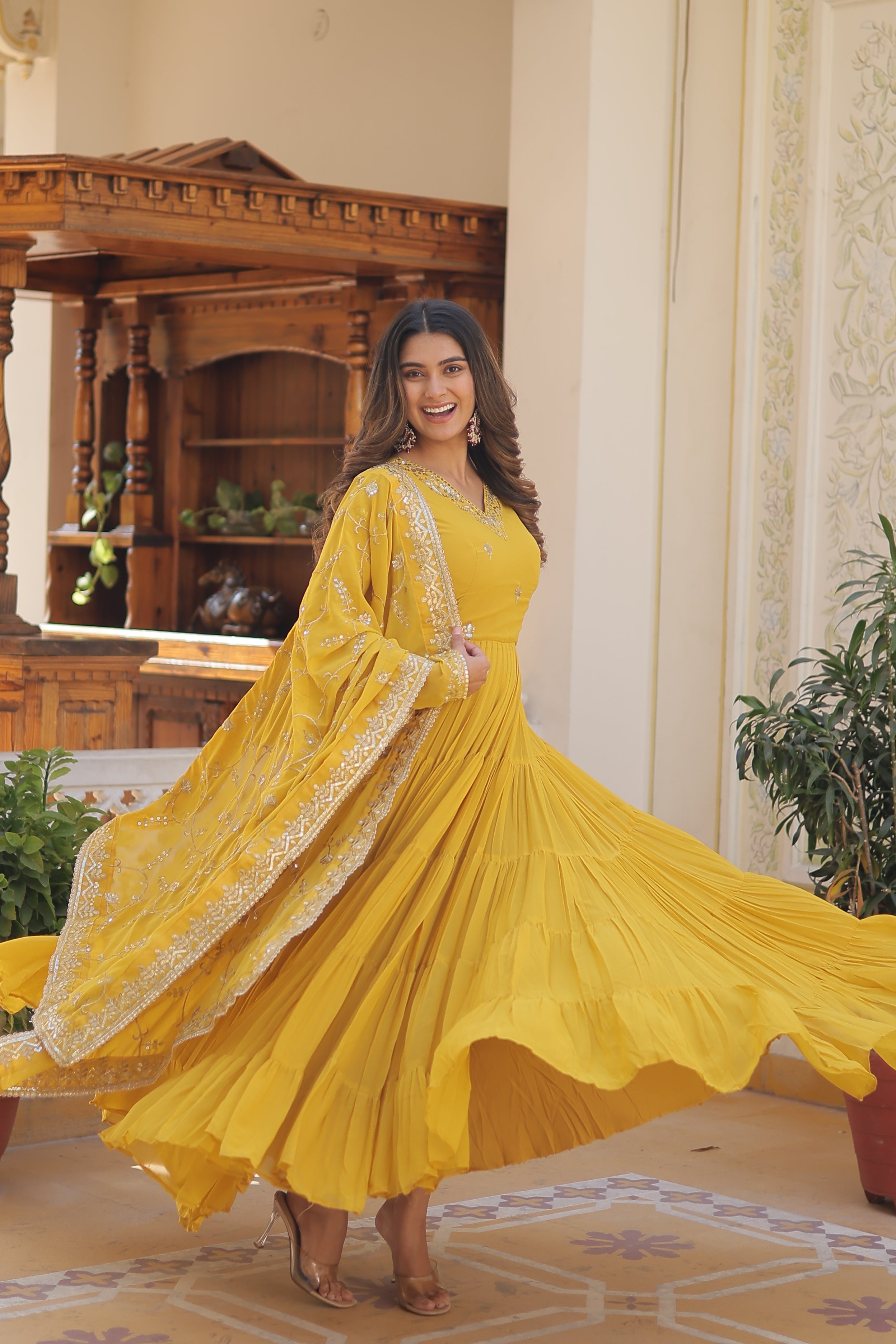 Pramukh Fab Yellow Embroidered Work Gown