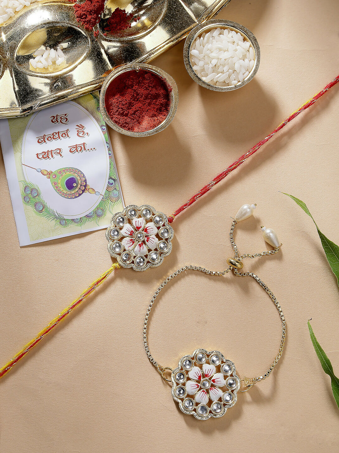 NVR Women & Men Set of 2 Gold Kundan-Studded Bhaiya Bhabhi Rakhi Set With Roli Chawal & Chocolate - Distacart