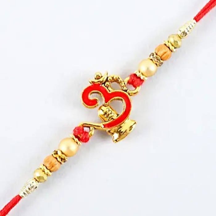 Auspicious Om Pearl Rakhi & Cadbury Fruit N Nut