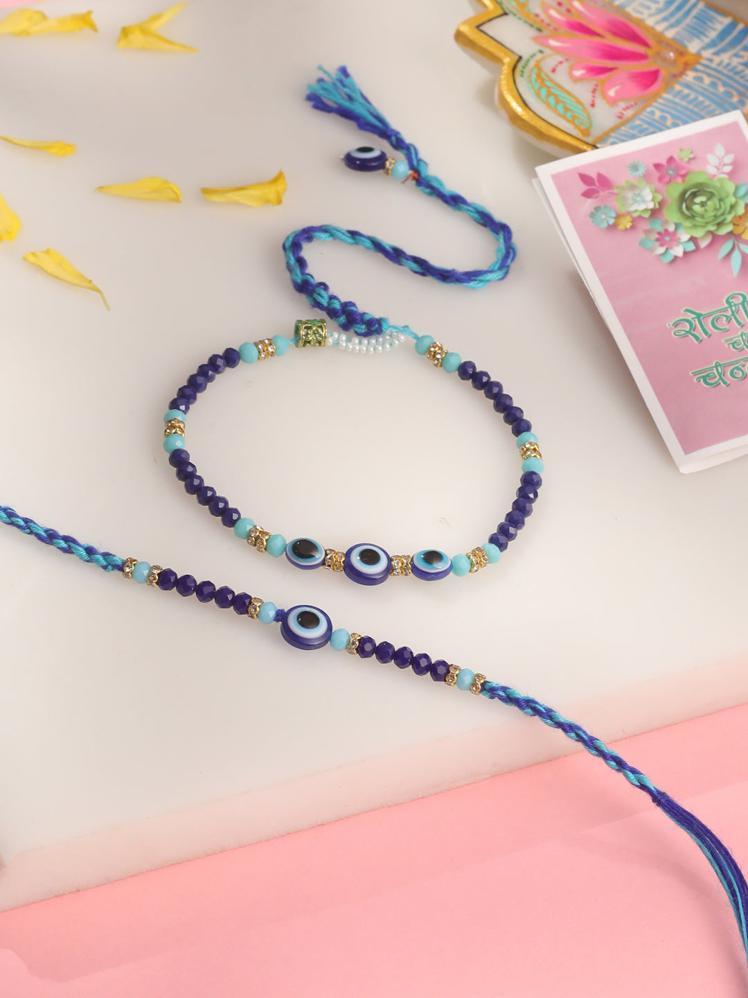 NVR Set of 2 Blue Evil Eye Artificial Beads Bhaiya Bhabhi Rakhi with Roli Chawal Chandan & Mishri - Distacart