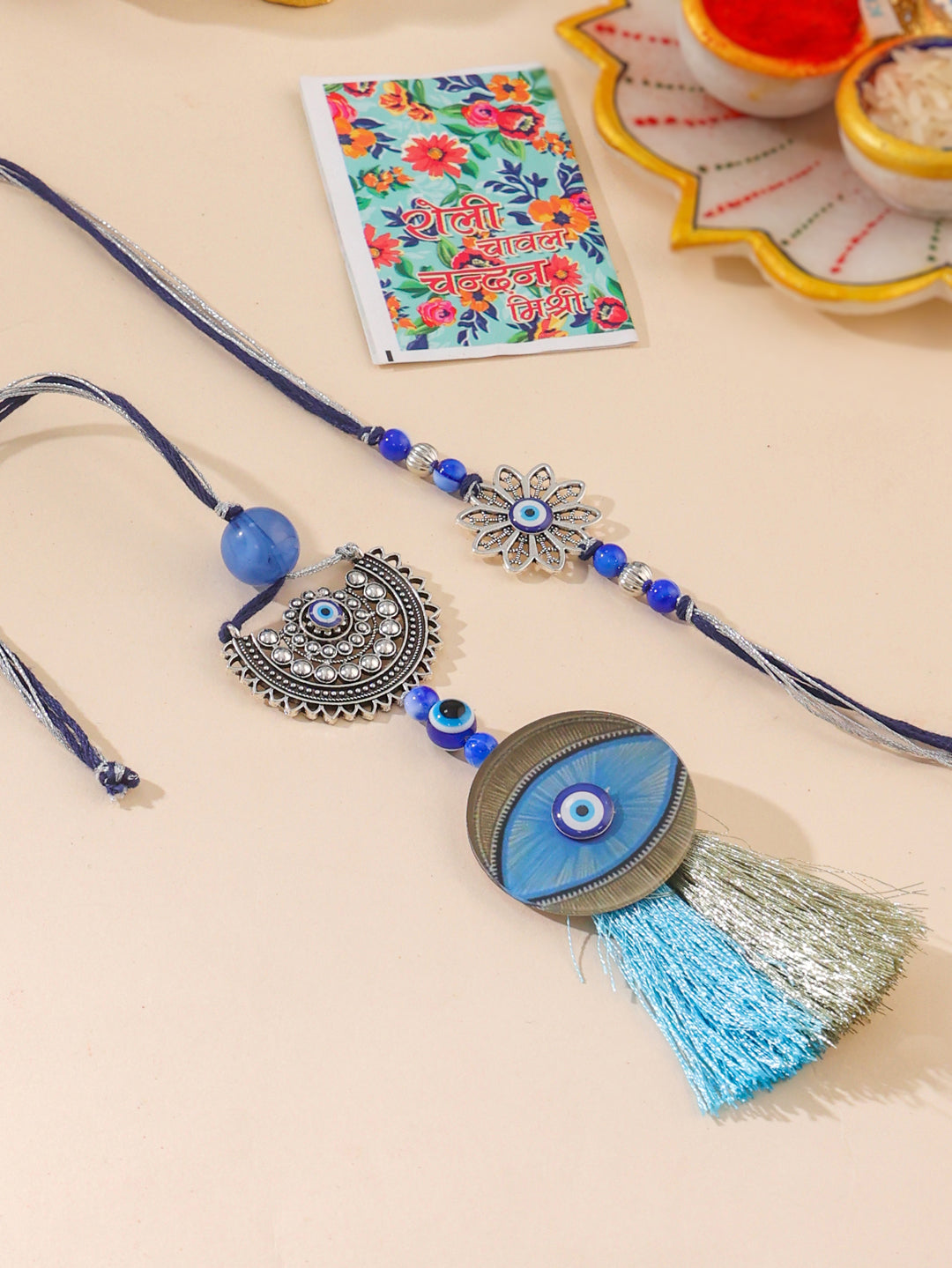 NVR Set of 2 Blue Evil Eye Artificial Beads Bhaiya Bhabhi Rakhi with Roli Chawal Chandan & Mishri - Distacart