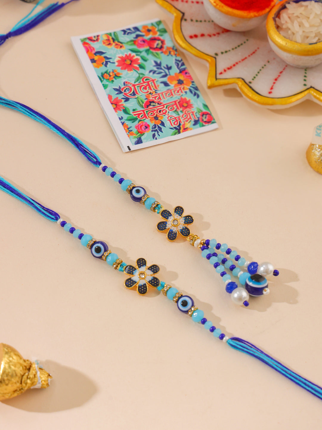 NVR Set of 2 Blue Artificial Beads Evil Eye Bhaiya Bhabhi Rakhi with Roli Chawal Chandan & Mishri - Distacart
