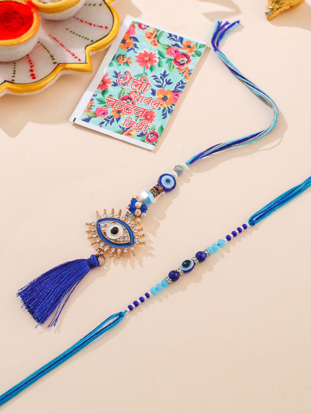 NVR Set of 2 Blue Evil Eye Artificial Stones & Beads Bhaiya Bhabhi Rakhi with Roli Chawal Chandan & Mishri - Distacart